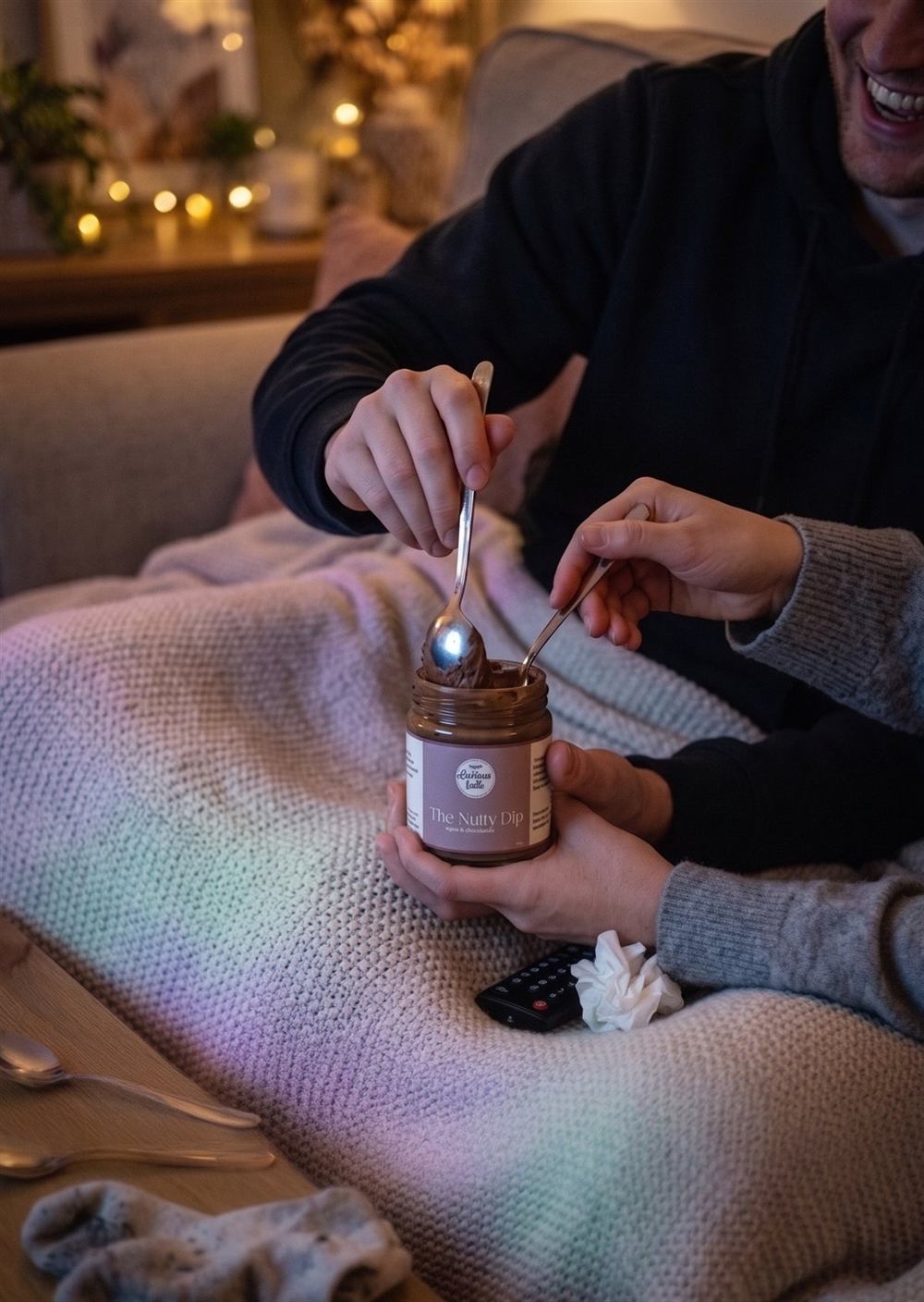 A couple sharing The Nutty Dip together on the couch